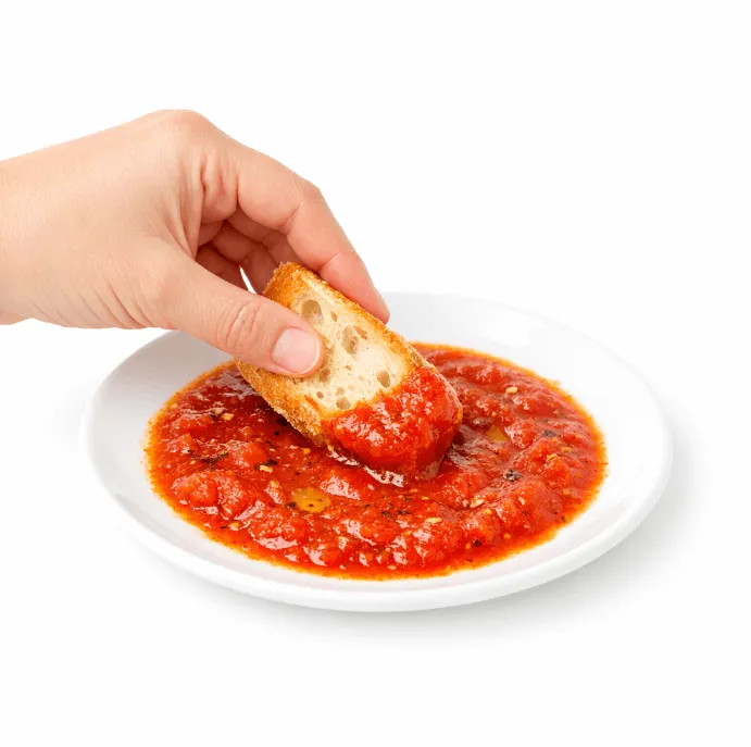 A hand making scarpetta on a dish